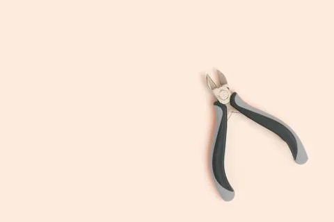 Wire cutters on a beige background. Stock Photos