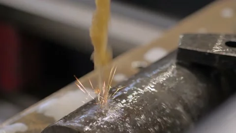 Wire cutting machine working with metal workpiece with sparks at factory Stock Footage 142710115