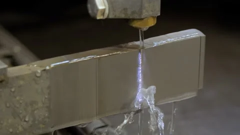 Wire cutting machine working with metal workpiece with sparks at factory Stock Footage 167477874