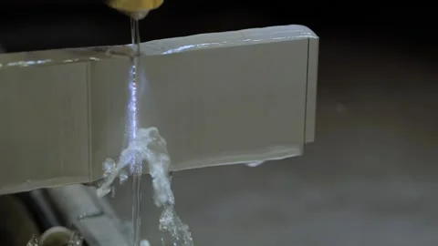 Wire cutting machine working with metal workpiece with sparks at factory Stock Footage 196495460