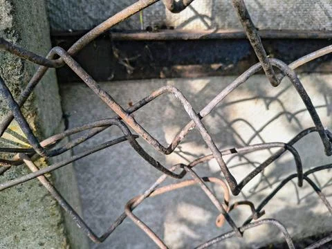 Wire fence. chain link mesh. rusty iron fence. old rusty cage. symbol of fr.. Stock Photos