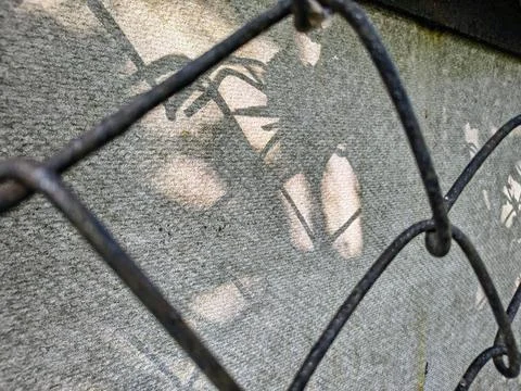 Wire fence. chain link mesh. rusty iron fence. old rusty cage. symbol of fr.. Stock Photos