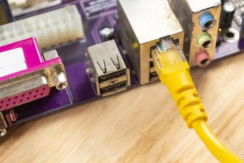 The wire is inserted into the motherboard Stock Photos