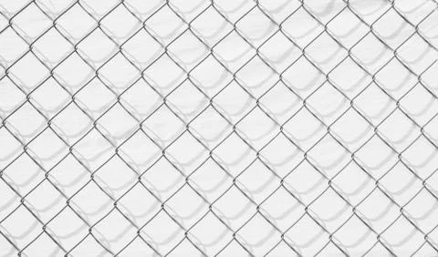 Wire mesh and shadow on white wall background Stock Photos