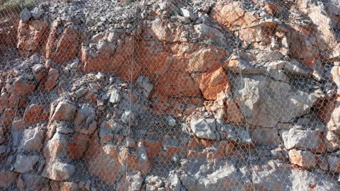 Wire mesh metal net protection against falling rocks. Metal net Stock Footage 164576396
