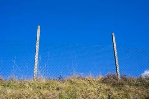 Wire netting as barrier. Stock Photos