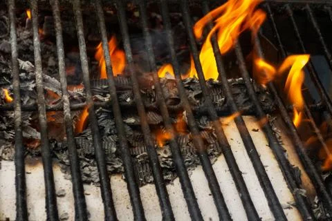 Wire rack on fireplace. Flame, burning paper and ash close up image. Concept  Stock-Fotos