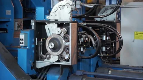 Wire rolling mill coil forming laying head at steel plant Stock Footage 89717311