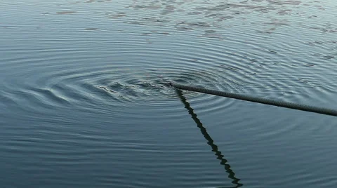 Wire rope making circles in the water, slow motion Stock-Footage 67455118