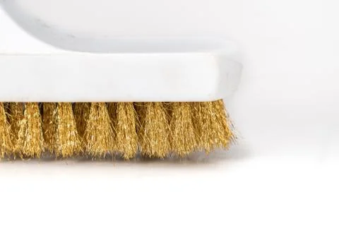 Wire Scratch Brush, Brass with Plastic Handle on white background. Stock Photos