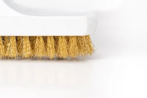 Wire Scratch Brush, Brass with Plastic Handle on white background. Stock Photos