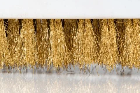Wire Scratch Brush, Brass with Plastic Handle on white background. Stock Photos