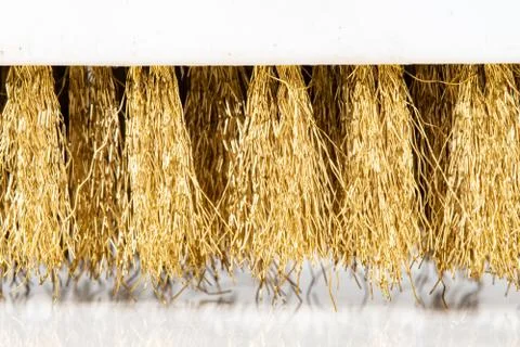 Wire Scratch Brush, Brass with Plastic Handle on white background. Stock Photos