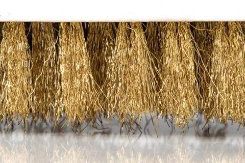Wire Scratch Brush, Brass with Plastic Handle on white background. Stock Photos