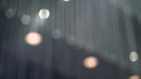 Wire string lights on ceiling, abstract blur background 動画素材 127107572
