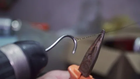 Wire weaving with pliers and screwdriver closeup Stock Footage 102176502