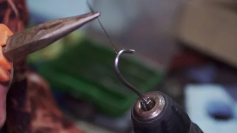 Wire weaving with pliers and screwdriver close up Stock Footage 102176530