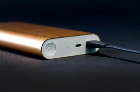 Wired external portable battery for charge cell phone, Stock Photos