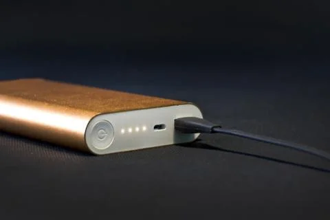 Wired external portable battery for charge cell phone, Stock Photos