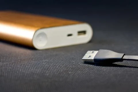 Wired external portable battery for charge cell phone, Stock Photos