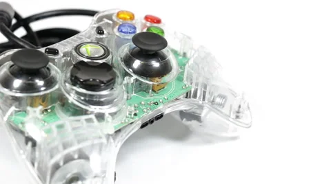 Wired game controller rotating on white background Stock Footage 40413870