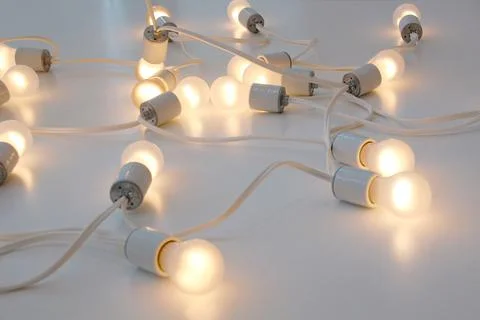 Wired lamps, ideas. Creativity and connection between diverse ideas, entrepre Stock Photos