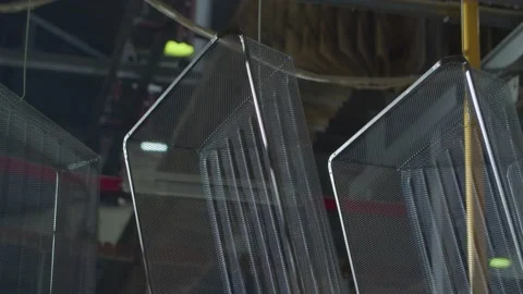 Wired mesh cages moving on the track in the factory Stock Footage 152773853