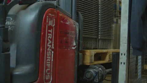 Wired mesh cages moving on the track in the factory Stock Footage 152781189