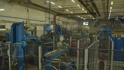 Wired mesh cages moving on the track in the factory Stock Footage 152781223