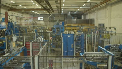 Wired mesh cages moving on the track in the factory Stock Footage 152781284