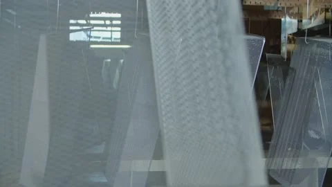 Wired mesh cages moving on the track in the factory Stock-Footage 153468615