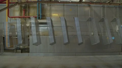 Wired mesh cages moving on the track in the factory Stock Footage 153469279
