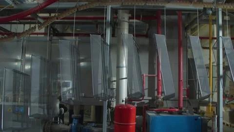 Wired mesh cages moving on the track in the factory Stock Footage 153469322