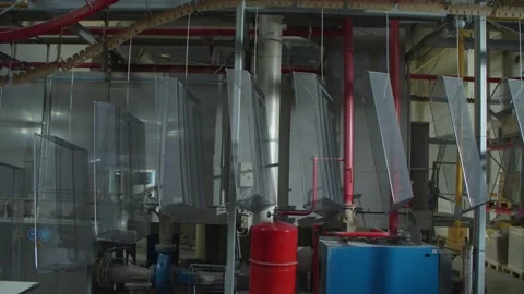 Wired mesh cages moving on the track in the factory Stock Footage 153469365