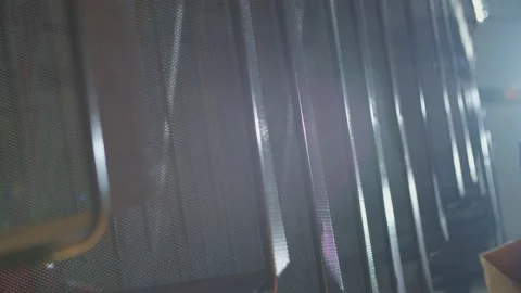 Wired mesh cages moving on the track in the factory Stock Footage 153469383