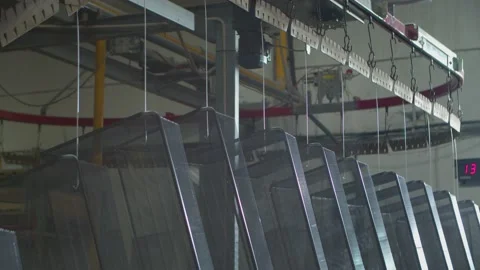 Wired mesh cages moving on the track in the factory Stock Footage 153469488