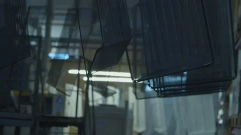 Wired mesh cages moving on the track in the factory Stock Footage 153469554
