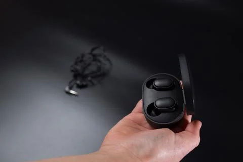 Wireless against wired. Chosing wireless headphones. Stock Photos