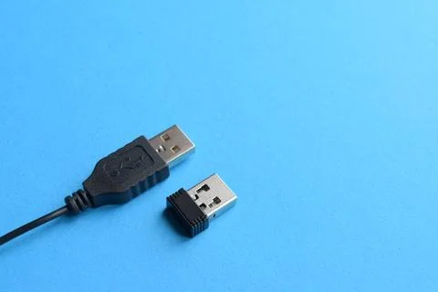 Wireless and wired USB cable on a blue background Stock Photos