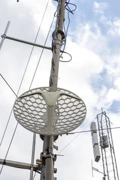 Wireless antenna technology on communication pole with network tower Stock Photos