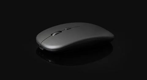 Wireless black mouse isolated on black background Stock Photos