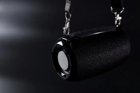 Wireless black speaker. wireless speaker with belt. Stock Photos