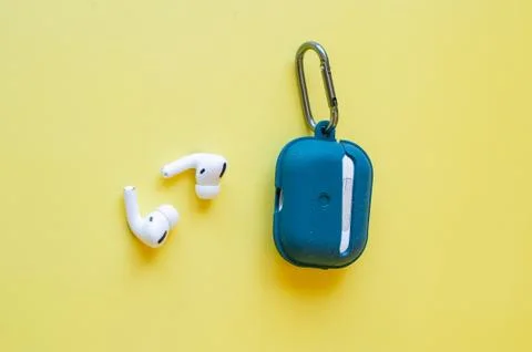 Wireless Bluetooth Earphone or Earbud or Headphone, Isolated on yellow backgr Stock Photos