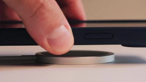 Wireless charging smartphone. Close-up of mobile phone charging with charging. Stock Footage 316031163