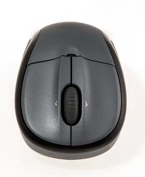 Wireless computer mouse with ergonomic design displayed on a white table Stock Photos