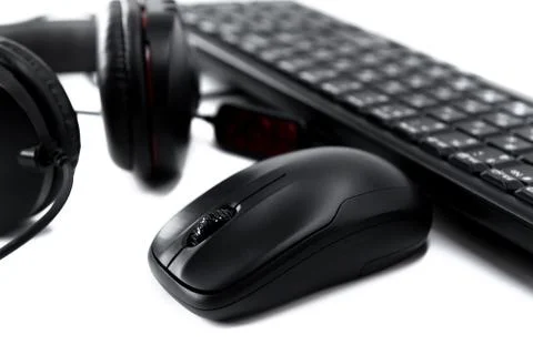 Wireless computer mouse, keyboard and headphones on a white background Stock Photos