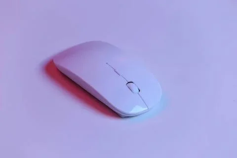 Wireless computer mouse on a light purple background 스톡 사진