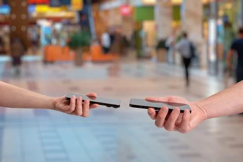 Wireless data exchange between two smartphones using close range communicat.. Stock Photos