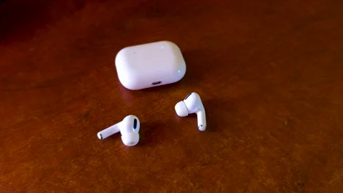 Wireless earbud charging case with two earbuds. Stock Footage 323961424