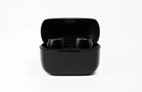 Wireless Earbuds and Charging Case on White Background Stock-Fotos